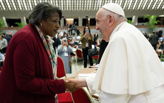 Pope Francis greets Cynthia Bailey Manns, a synod member and director of adult learning at St. Joan of Arc Parish in Minneapolis, before a session of the assembly of the Synod of Bishops Oct. 17, 2023, at the Vatican. (CNS/Vatican Media)